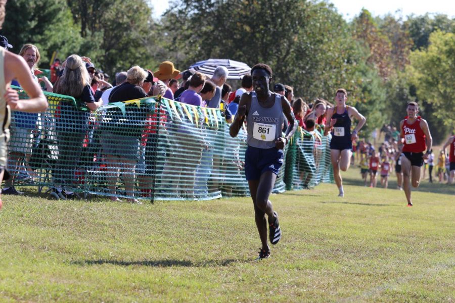 Fly to the finish: Sophomore David Kibet rounds a corner and creates distance on opponents. Kibet finished with a time of  25:08.52 on Sep. 18, 2021 at the Missouri Southern Stampede.