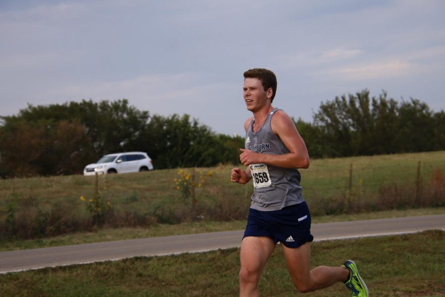 Sunset running: In the fourth mile Brett Kulp runs a steady pace. Brett finished his race in 27:53.2 earning 27 points for the team.