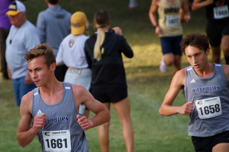 just keep running: Nick Petrella(left) and Cooper Griffin(right) work together focused on getting to the finish line. Nick ran a time of 28:28.9 and Cooper finished with  a time of 28:12.5.