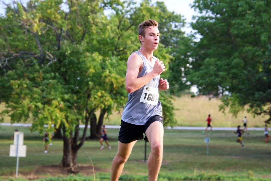 Concentration: Nick Petrella focus' on maintaining his pace during the race. Nick finished 42nd with a time of 28:28.9.