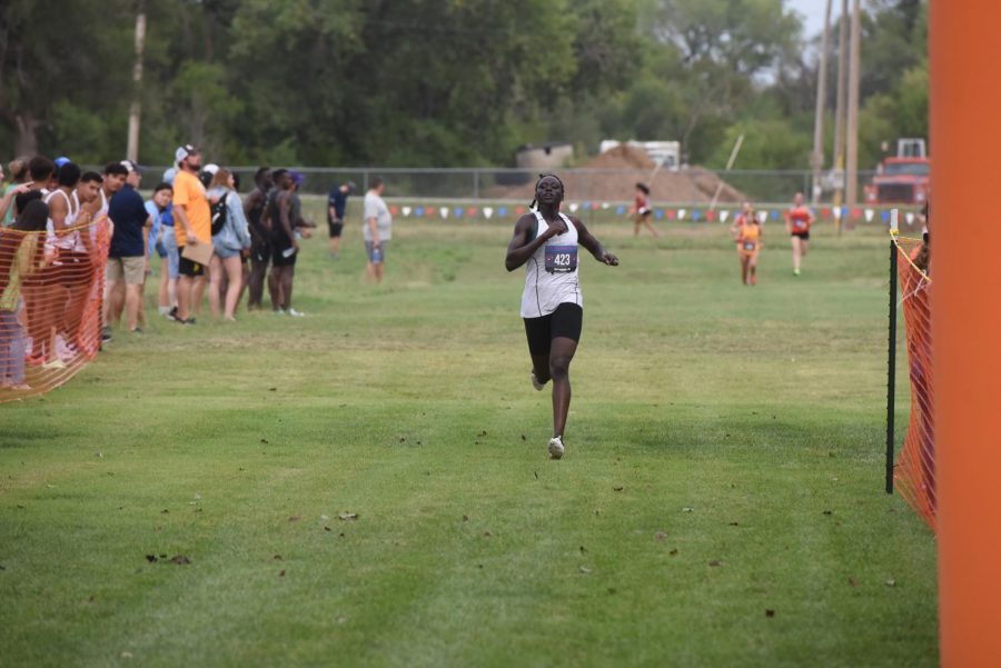 Finish strong: Sophomore Patricia Koma runs toward the finish on her way to winning the race with a time of 18:54.