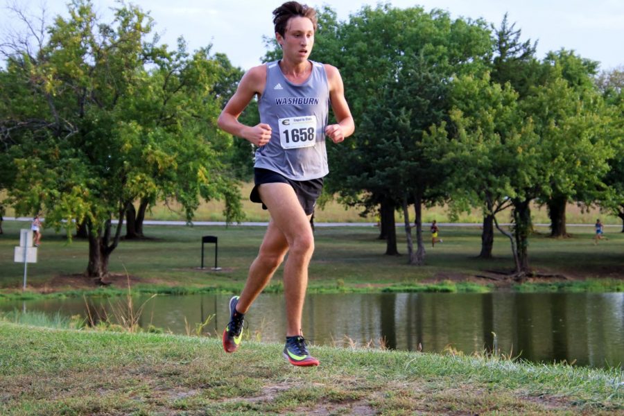 Floating along: Cooper Griffin, as seen mid-stride, keeps a steady stride to maintain his position. He will go on to finish with a time of 28:12.5, earning 31 points.