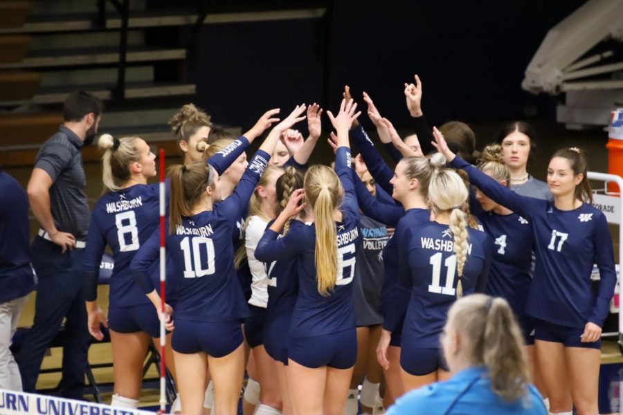 Hands in: The team celebrates after winning a set on Oct. 19, 2021. The Ichabods swept Fort Hays State 3-0 in the match.
