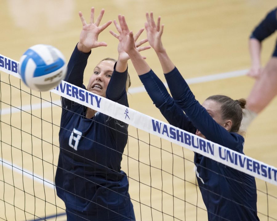 Try again: Washburn middle hitter Allison Maxwell (8) and Washburn outside hitter Genna Berg (1) block the ball Thursday, Oct. 21, 2021, at Lee Arena in Topeka, Kan. The duo combined to assist on six blocks in the match.