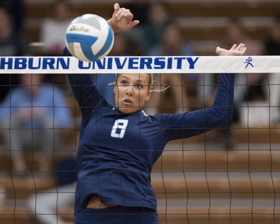 Soft touch: Washburn middle hitter Allison Maxwell (8) tips the ball Thursday, Oct. 21, 2021, at Lee Arena in Topeka, Kan. Maxwell had a .393 attack percent in the match.