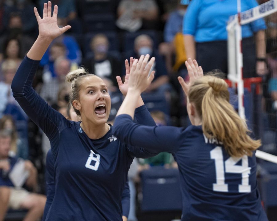 Big+point%3A+Washburn+middle+hitter+Allison+Maxwell+celebrates+with+Washburn+middle+hitter+Kelsey+Gordon+Tuesday%2C+Oct.+19%2C+2021%2C+at+Lee+Arena+in+Topeka%2C+Kansas.+The+duo+combined+for+19+kills+in+the+Ichabods+3-0+victory.