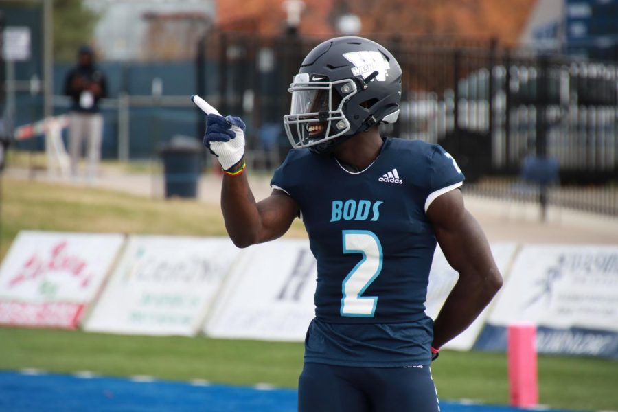 Celebrate%3A+Washburn+wide+receiver+Peter+Afful+%282%29+celebrates+his+touchdown+on+Nov.+13%2C+2021.+Afful+made+three+catches+in+the+game.