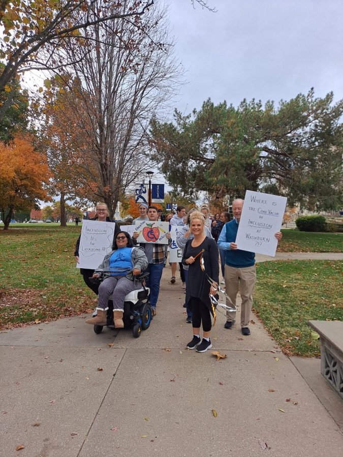 Daija Coleman leads the March on Inclusion around Washburn Campus to advocate for better accessibility into Carnegie Hall. The march took place on Nov. 10, 2021.