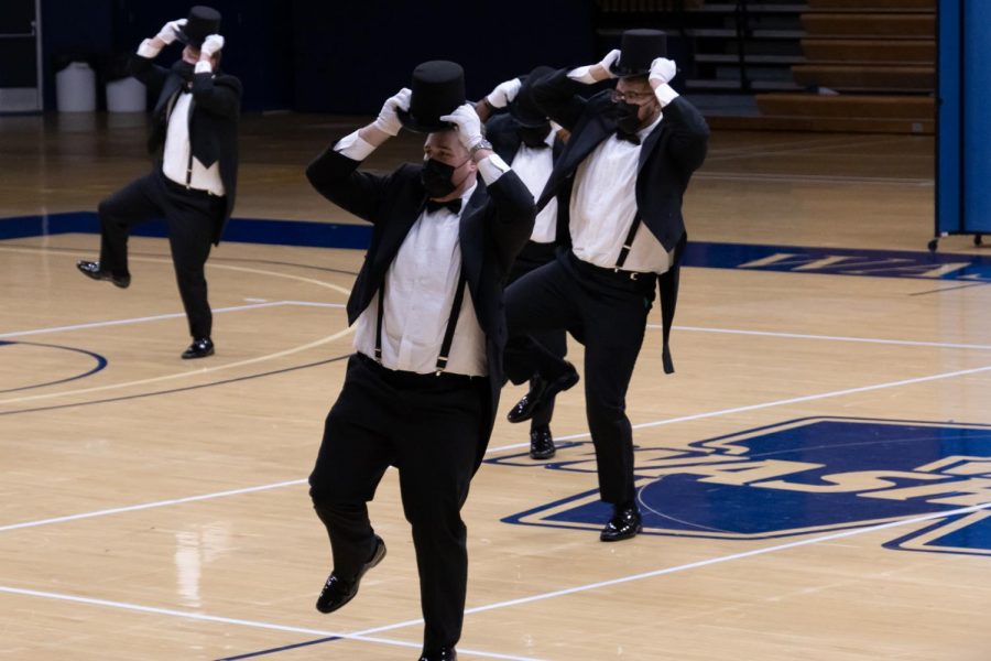 Hats off: The men of Kappa Sigma get into their dance. Washburn organizations performed at Yell Like Hell in Lee Arena on Thursday, Oct. 28, 2021.