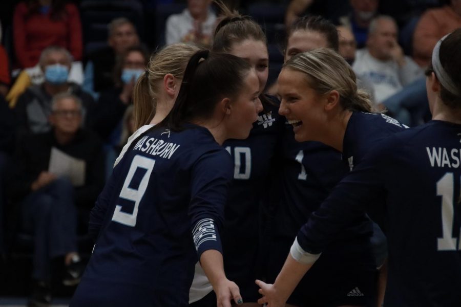 Let’s go: Washburn defensive specialist Chloe Paschal (9) and middle hitter Allison Maxwell (8) encourage each other on Nov. 12, 2021. Washburn defeated Missouri Western 3-0 in the match.