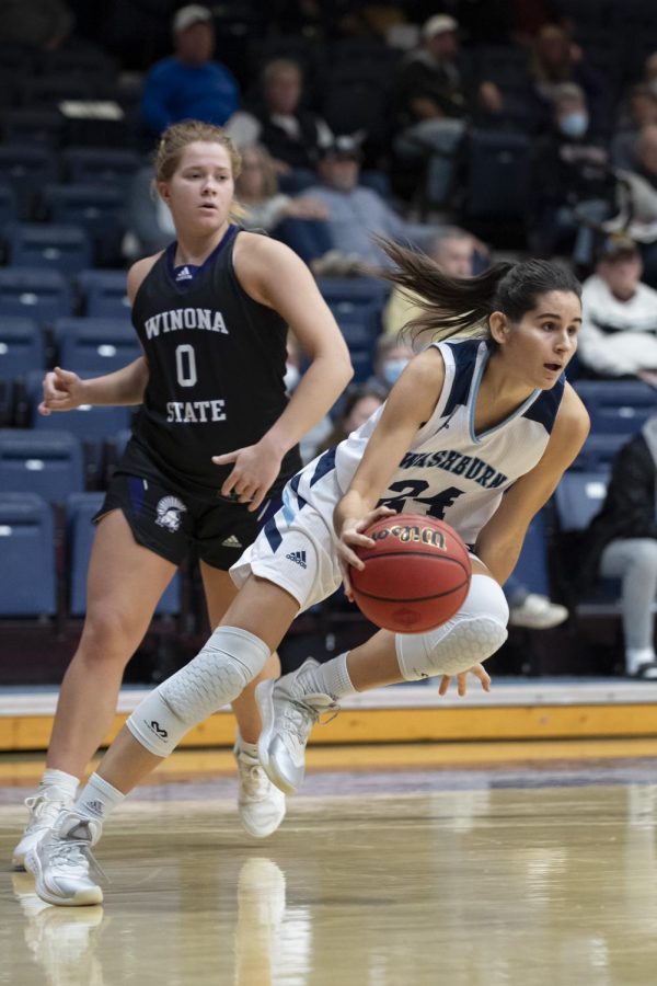 Washburn guard Nuria Barrientos (24) drives for the basket Friday, Nov. 26, 2021, at Lee Arena in Topeka, Kan. Barrientos recorded three rebounds in the game.