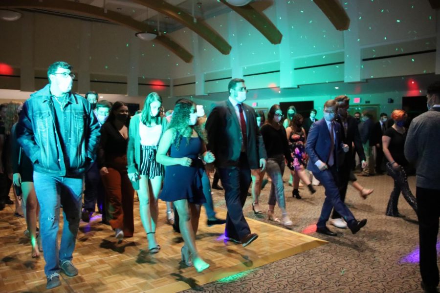 Party Time: Students line up on the dance floor, dancing to Cotton Eye Joe.