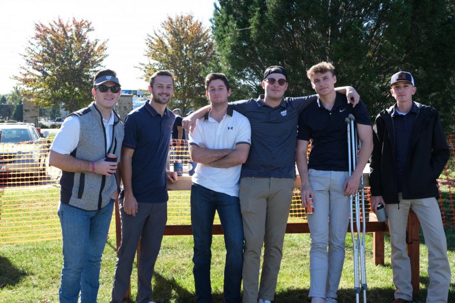 Brothers: The Washburn Phi Delta Theta member Tom, Carson, Ronan, Brayden Banks, and Jack make good smile on Oct 30, 2021. The homecoming tailgate held in Memorial Union lawn, Topeka, Kansas.