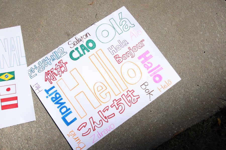Hello Board: The Washburn International club makes the hello board using the world languages on Oct. 30, 2021. The homecoming parade was held around Washburn Campus.