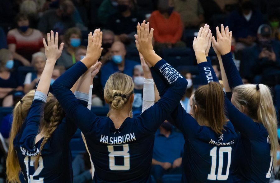 The+Ichabods+come+together+for+a+huddle+during+a+time-out+in+the+match+against+Emporia+State+on+Sept.+21%2C+2021.+Washburn+took+all+three+sets+of+the+match.