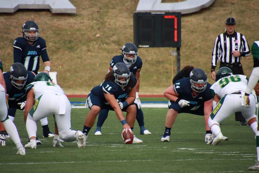 Set position: The Washburn center Mason Honne (76) sets to snap the ball on Nov. 13, 2021. The senior day final home game was held at Yager Stadium in Topeka, Kan.