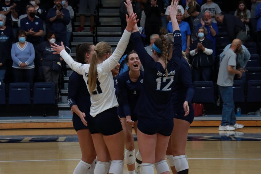 Washburn+volleyball+team+congratulates+each+other+after+a+point+on+Nov.+16%2C+2021.+The+MIAA+championship+tournament+game+was+held+at+Lee+Arena%2C+Topeka%2C+Kansas.