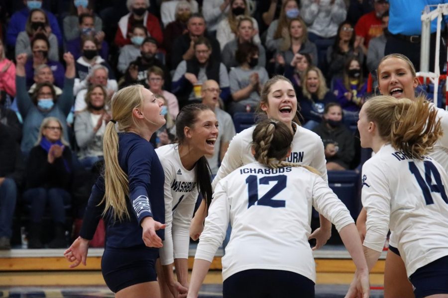 The team celebrates after knocking down a kill in the first set on Nov. 13, 2021. Washburn fell to Northwest Missouri 3-0 in the match.