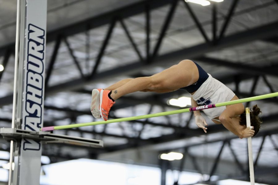 Washburn athlete jumps high for pole vault on Jan 22, 2022, Topeka, Kan.