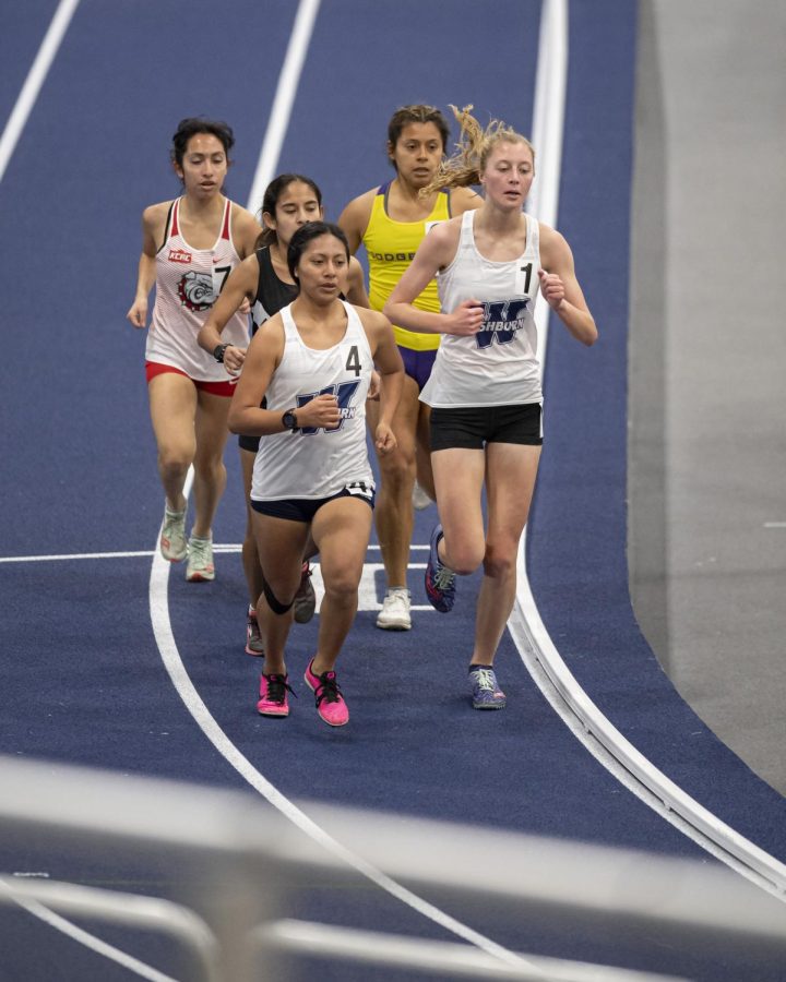 Washburn Luz Lopez-Gonzalez (left) and Megan Allacher (right) compete in the women’s 3000m Saturday Jan. 22, 2022, at Washburn University in Topeka, Kan.