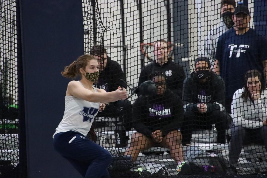 Freshman+Tyler+Smith+spins+before+throwing+in+the+weight+throw+event+Jan.+15%2C+2022.+Smith+finished+with+a+throw+of+11.37+meters.