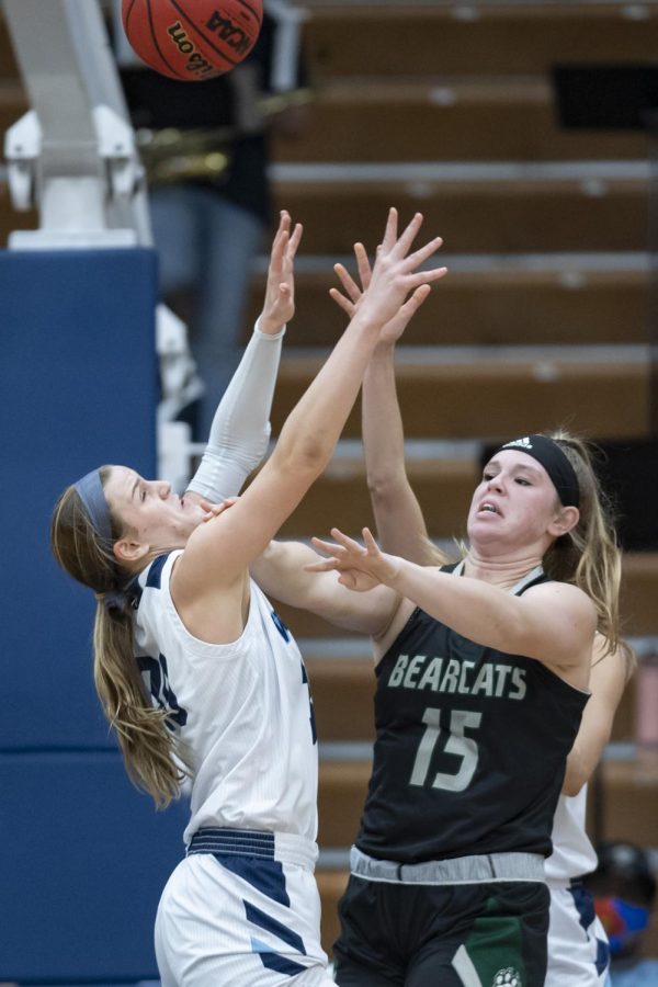 Washburn+guard+Macy+Doebele+%2830%29+reaches+for+a+rebound+against+Northwest+Missouri+State+forward+Kelsey+Fields+%2815%29+Monday%2C+Jan.+17%2C+2022%2C+at+Lee+Arena+in+Topeka%2C+Kan.+Doebele+pulled+down+four+rebounds+in+the+game.