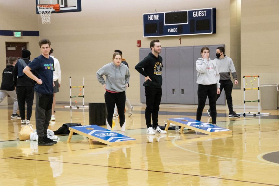 Students engage in some friendly competition with a game of cornhole. Late Night at the Rec was Feb. 25, 2022.
