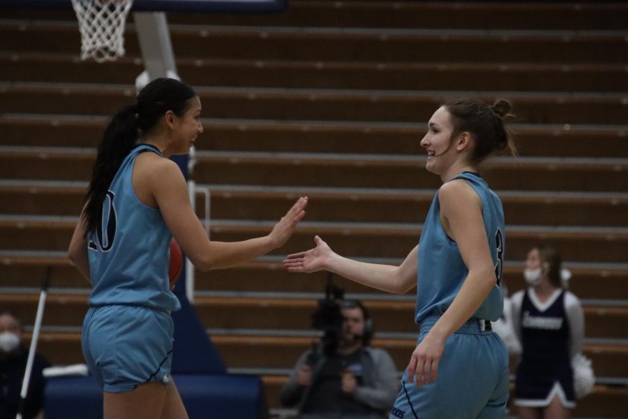 Senior guard Shae Sanchez (left) and freshman guard Aubree Dewey (right) high-five after a basket Jan. 29, 2022. Sanchez scored 14 points and Dewey scored six in the game.