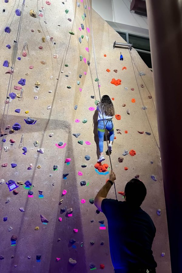Students challenge themselves on the rock wall. Late Night at the Rec was Feb. 25, 2022.