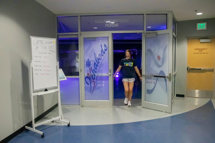 Khalea Bergman, a group fitness instructor at the SRWC, invites students into her class. Bergman was excited to share her love for creativity and dance through her classes.