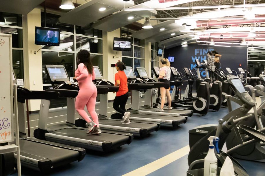 Some students try out the treadmills and ellipticals upstairs. Late Night at the Rec was Feb. 25, 2022.