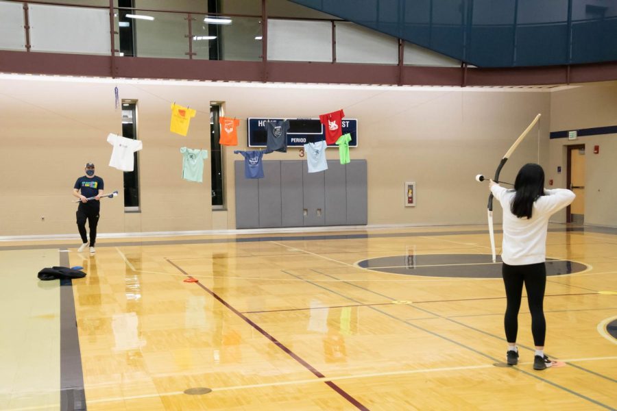 A student aims for a t-shirt with a foam-tip arrow. T-shirt archery was another new activity, giving students the chance to win a t-shirt.
