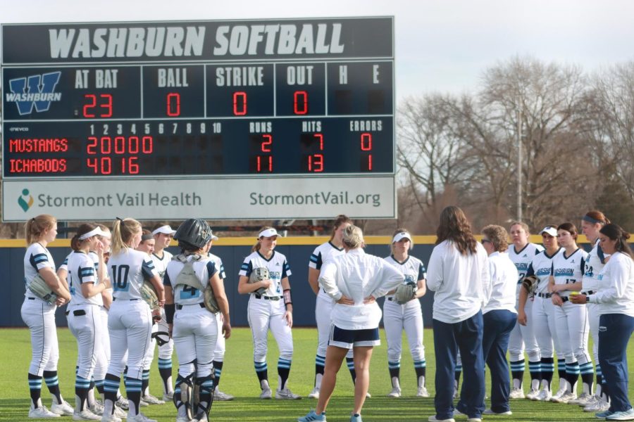 The Washburn softball team has a meeting after celebrating Feb. 28, 2022, Topeka, Kansas. Washburn defeated Southwest Minnesota State 11-2 in the game.