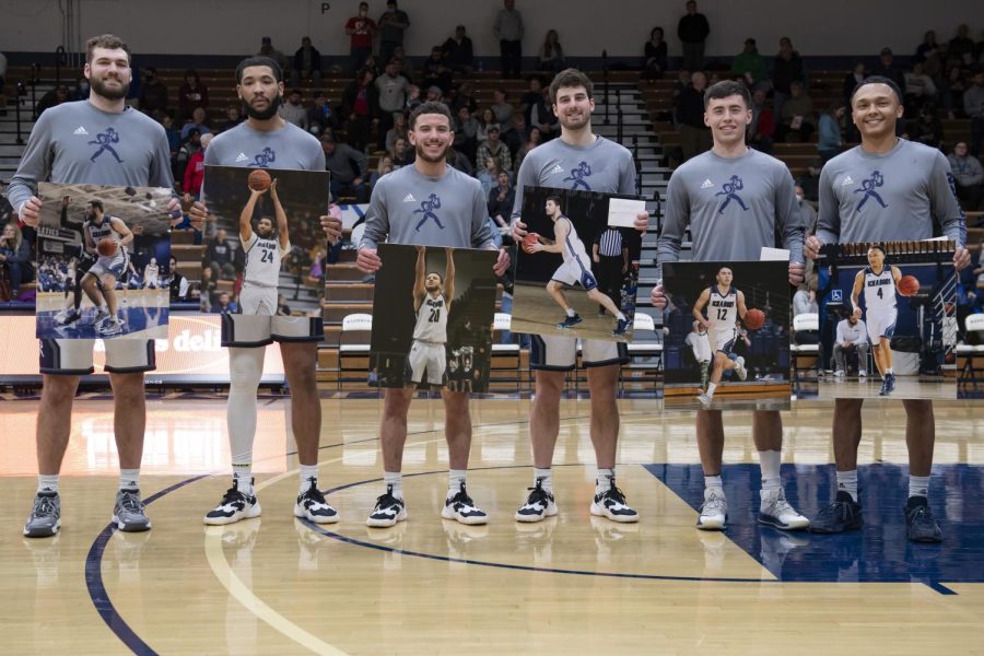 The Washburn boys basketball seniors pose before the game Thursday Feb. 24, 2022, at Lee Arena in Topeka, Kansas. Washburn defeated Missouri Southern 81-69 in the game.