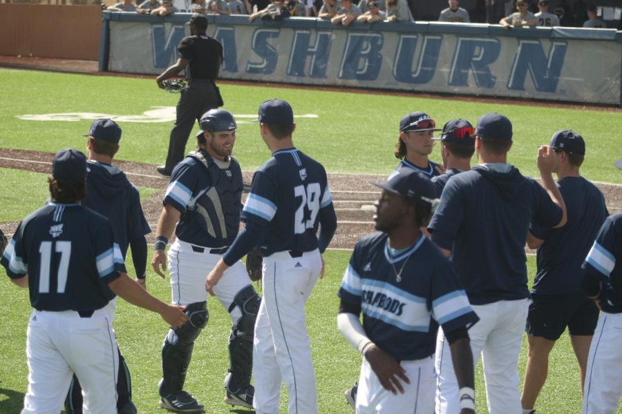 Washburn celebrates after a scoreless inning in the field Feb. 28, 2022. The Ichabods won 14-9 in the game.