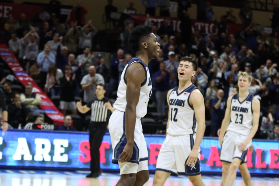Sophomore guard Tyler Nelson (14) and senior guard Tyler Geiman (12) celebrate after scoring Mar. 4, 2022. Washburn defeated Emporia State 88-81 in the game.