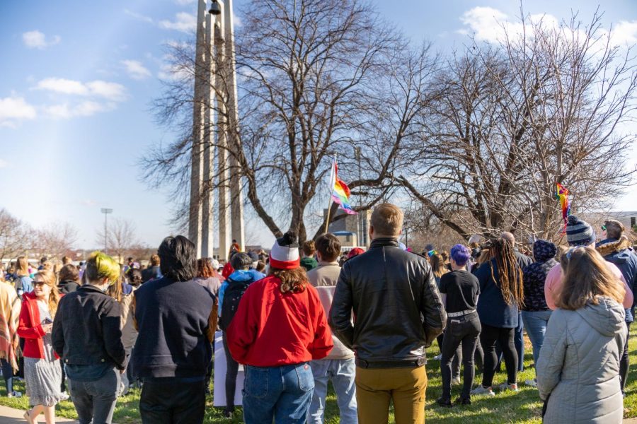 Students wear their Pride apparel and surround the Kuehne bell Tower to listen to different members of the trans community speak about their experiences. The LGBTQ+ Solidarity Gathering took place on Thursday, March 31, 2022, on the East Union Lawn at Washburn University.