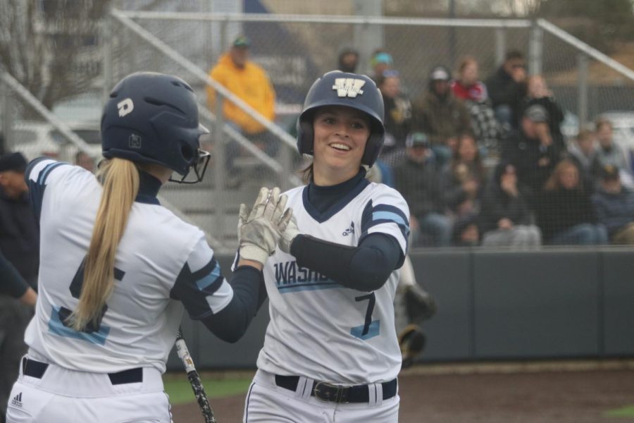 Junior+Jenna+Moore+smiles+after+scoring+a+run+April+1%2C+2022.+Moore+had+one+hit+in+game+two+of+the+day.