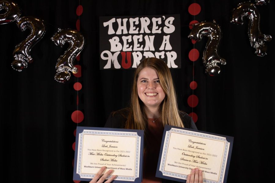 Leah Jamison with her awards for outstanding student in mass media and outstanding student in service to mass media, respectively. 