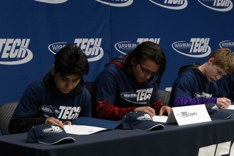 Prospective students sign their letters of intent to attend Washburn Tech in the fall. The total number of signees for the day was 305.