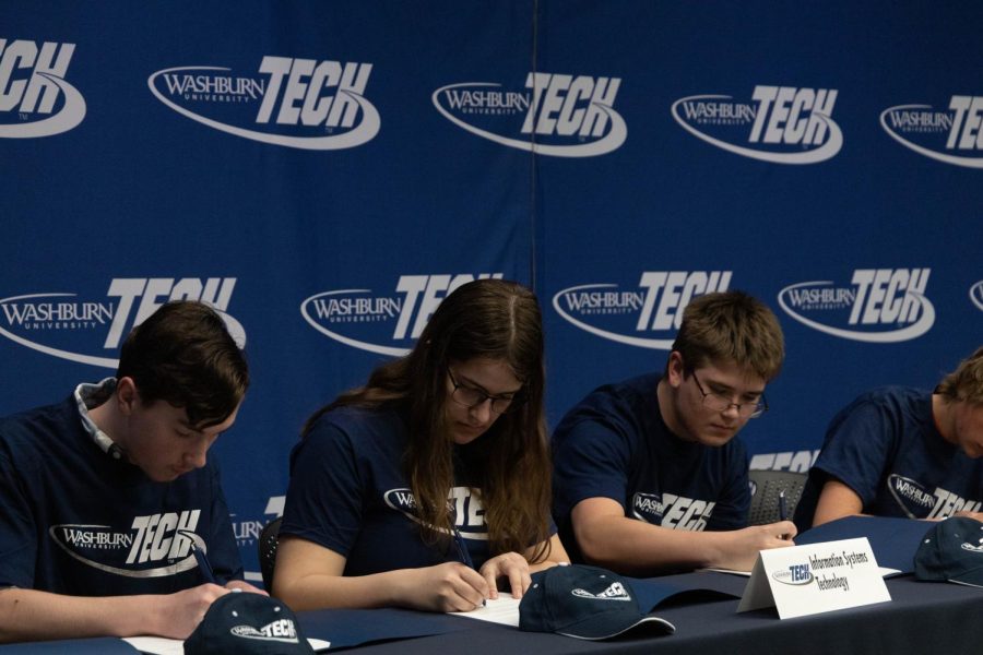 Future information systems technology students sign their letters of intent. More than 300 students signed April 14, 2022.