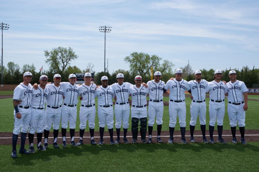Washburns group of 13 seniors pose for a picture before the game May 1, 2022. The seniors were recognized before the game.