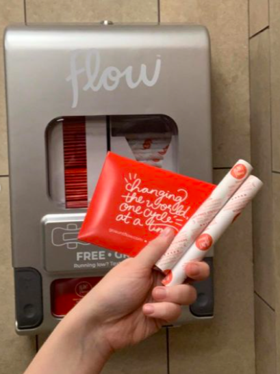 Student Chloe Chaffin showcases the menstrual products that can now be found in womens restrooms on campus. This project took several months to complete.