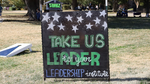 The Leadership Institute’s Homecoming sign on the Union lawn. The Institute held their Homecoming tailgate Oct. 22, 2022.