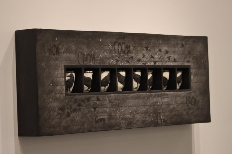 “Calling Crows” by Lissa Hunter features crow baskets made out of coiled wire-centered paper cord, waxed linen thread, paper and encaustic wax. The crow box is made of acrylic paint, charcoal wax pencil drawn fiberboard and drywall.