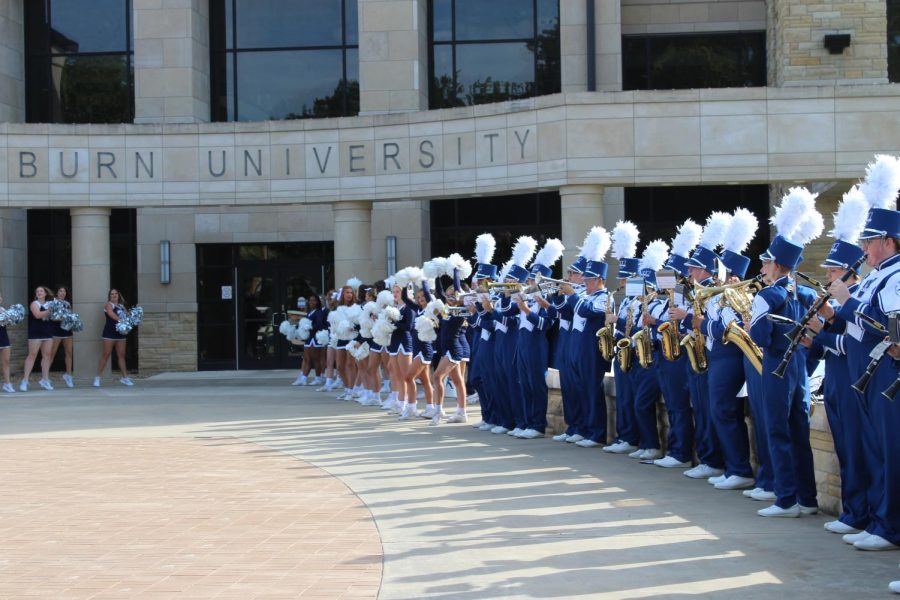 Cheerleaders and band celebrate as they await Farley’s send off. Washburn held a farewell send off for former president Jerry Farley on Sept. 30.