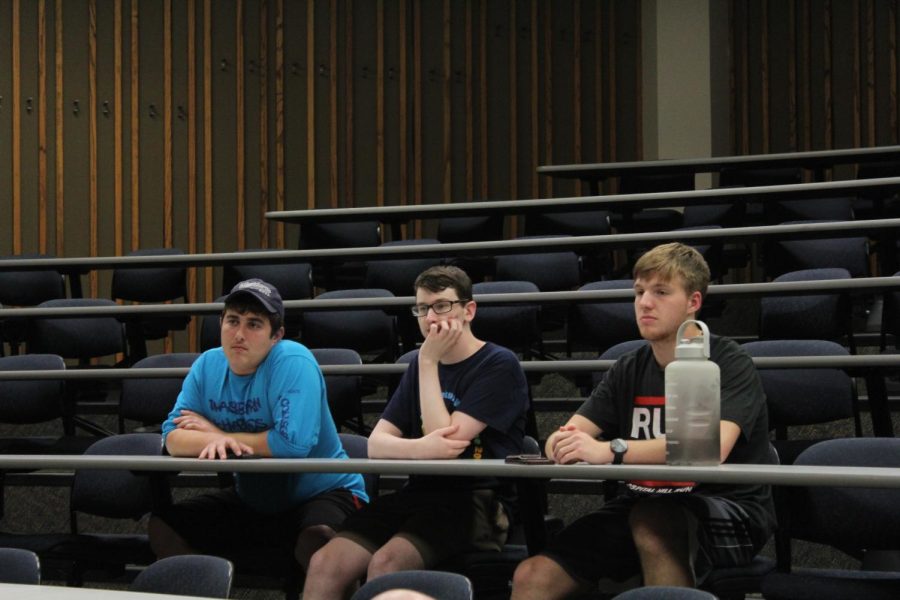 Washburn students listen closely to professor Tom Prasch as he talks about the movie. The movie depicted the crisis in the monarchs reign, immediately after the death of peoples princess Diana.