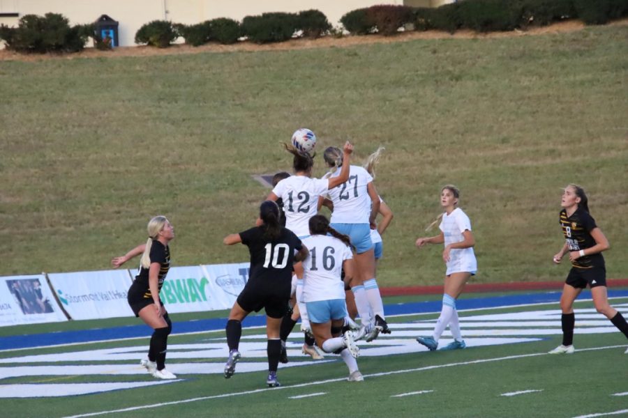 Freshman Belle Kennedy and senior Emily Michaelis go up for the header. Both players played significant minutes in the game against the Griffons.