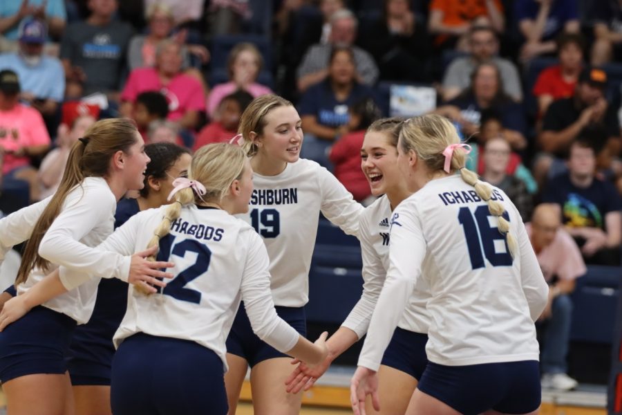 Washburn+huddles+together+after+a+point+for+Newman+University+in+the+third+set.+The+Ichabods+came+together+to+win+the+final+set+25-23.