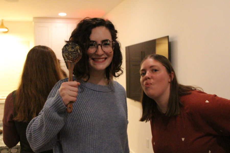 Claire Grace Cogswell and Lilly Thompson admire a dirty spoon. Young Life small groups meet regularly every Tuesday evening.